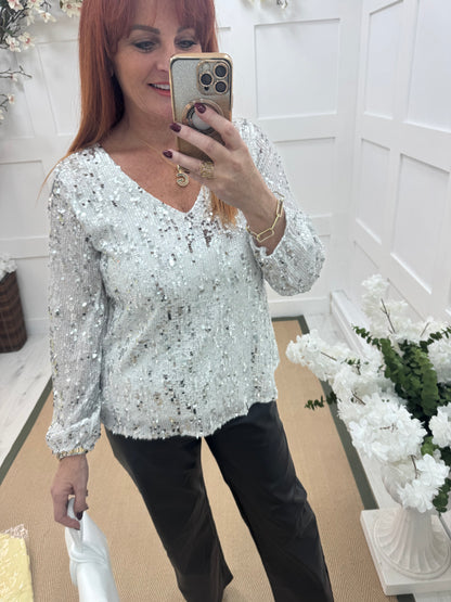 Sutton: White v-neck sequin top. One size: 12-16