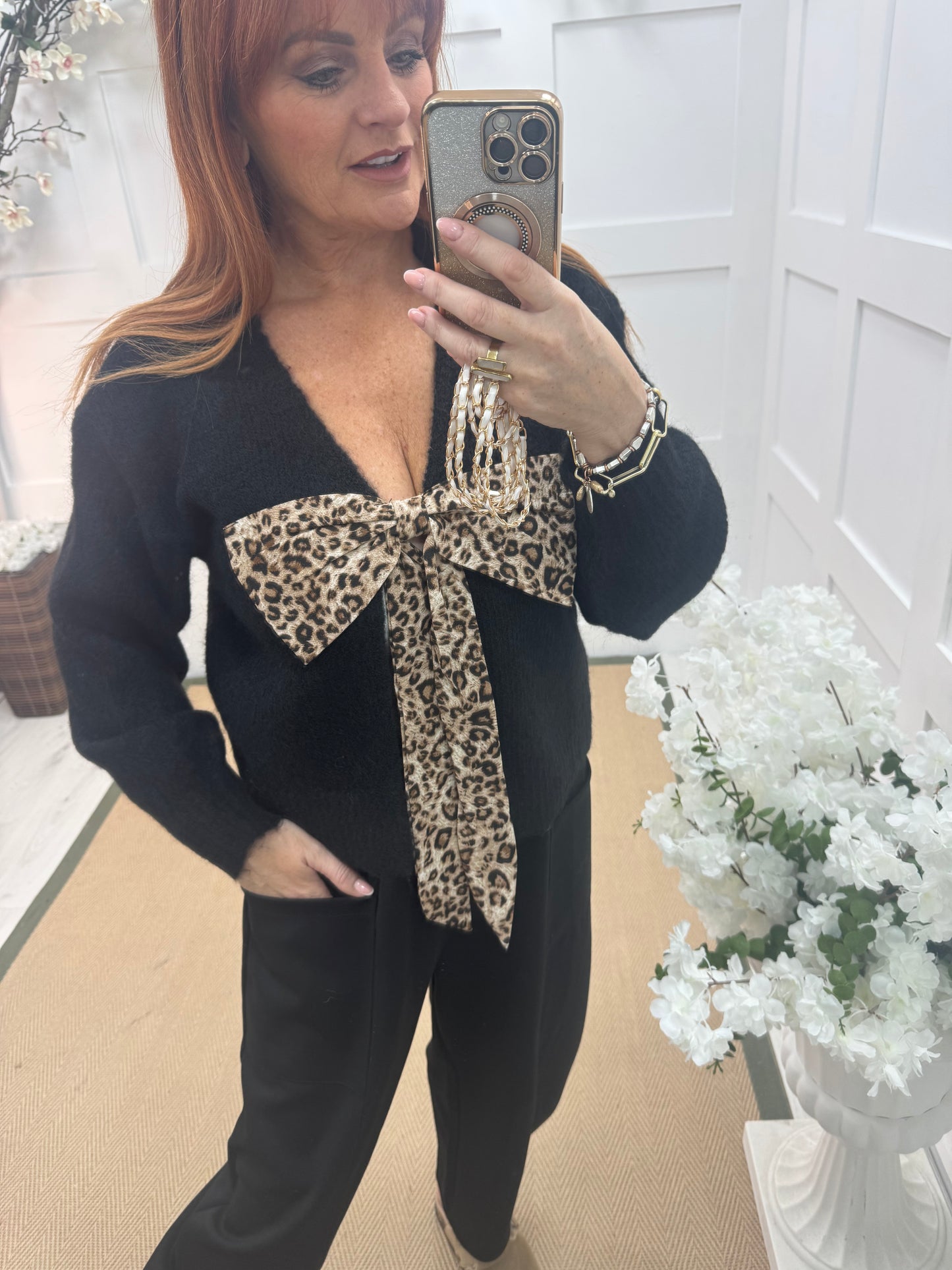 Jinx: Black wool leopard bow top. One size: 12-16