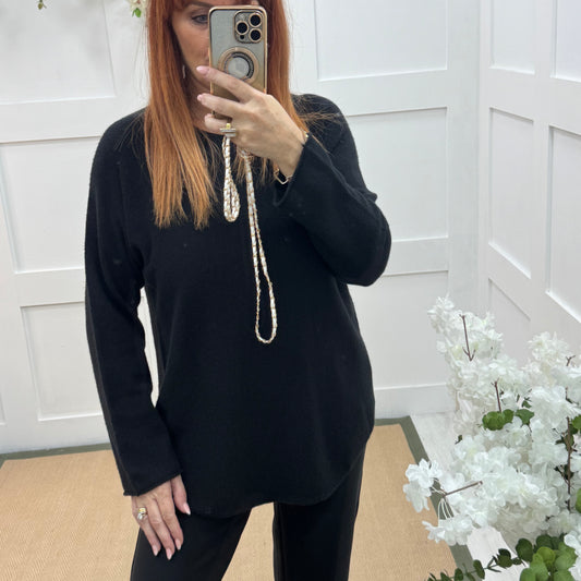 Mindy: Black plain long sleeve knit top. One size: 10-16/18