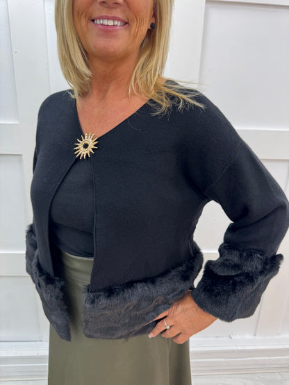 Pixi: Black faux fur & gold buckle coatigan. One size: 12-18