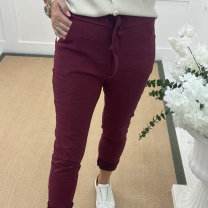 Marnie: Stretchy burgundy magic trousers with rear pockets. 3 Sizes: 10-22