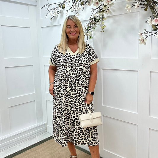 Luna: Cream trim leopard print dress with pockets. One size: 16-20