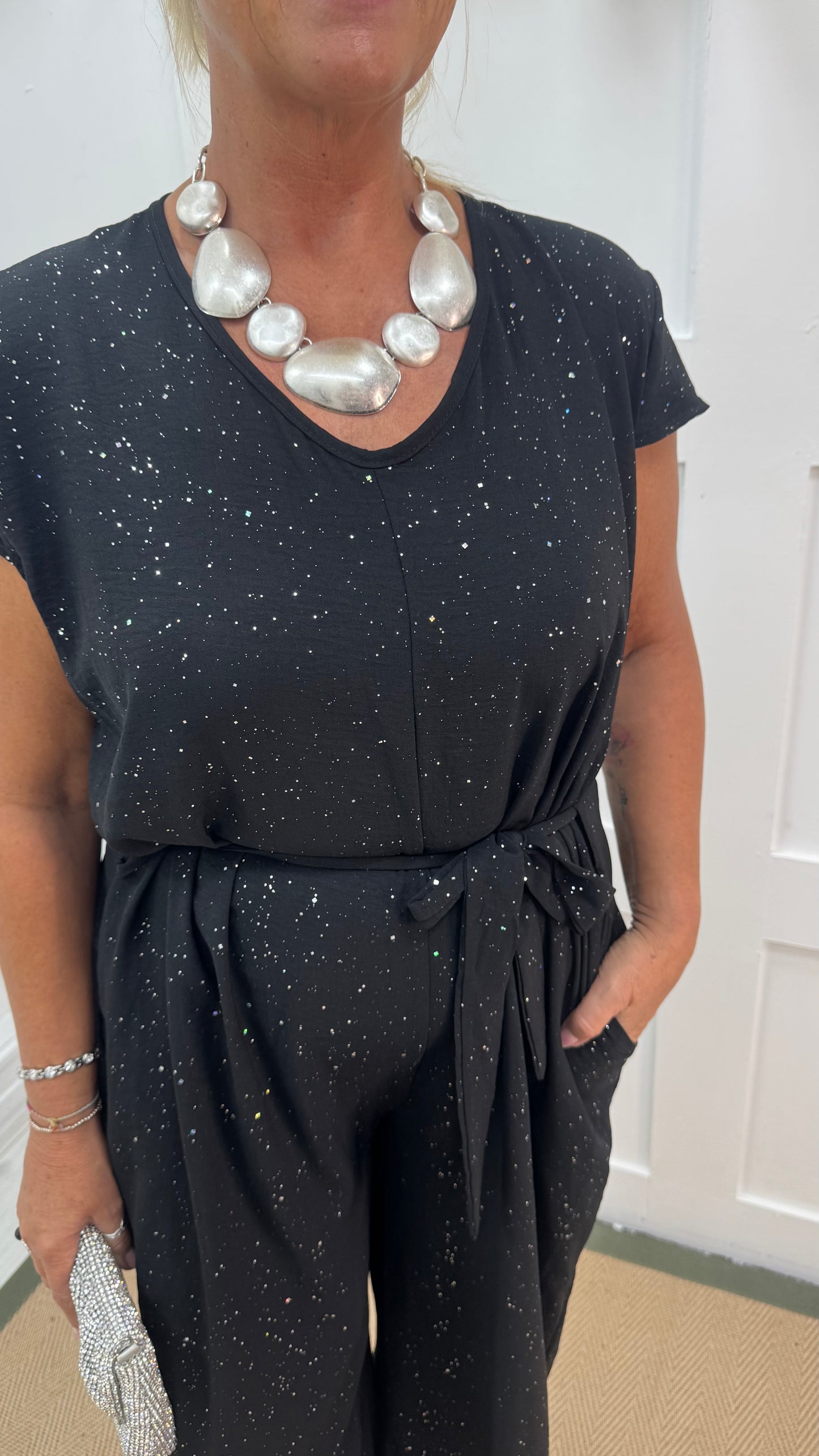 Gia: Black sparkle tie-waist wide leg jumpsuit. One size: 12-18