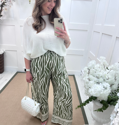 Skye: Khaki zebra print wide leg trousers. One size: 10-16