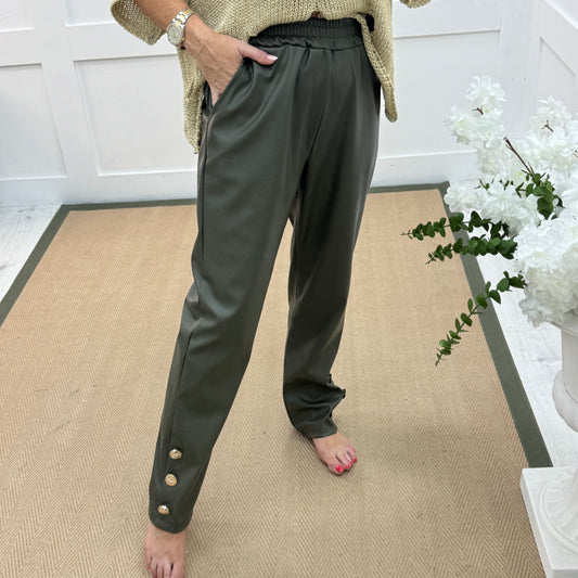 Tatum: Khaki faux leather button trousers. One size: 14-18