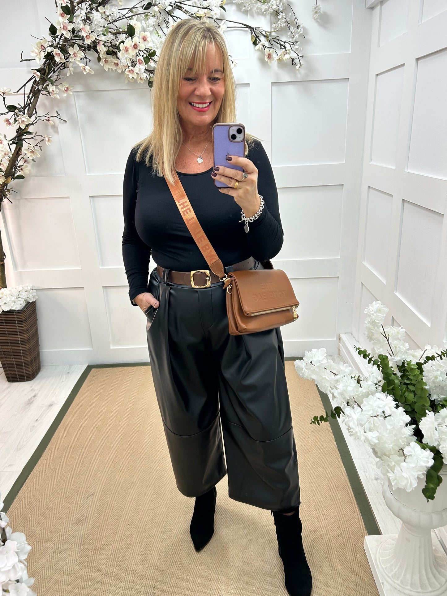 Allegra: Black 3/4 faux leather belted trousers. One size: 14-18