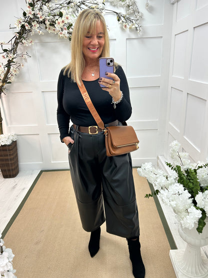 Allegra: Black 3/4 faux leather belted trousers. One size: 14-18