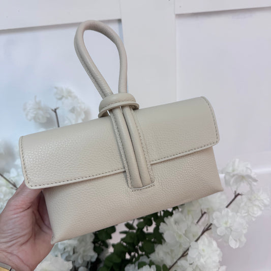 Alexis: Cream leather loop handle cross body/clutch bag.
