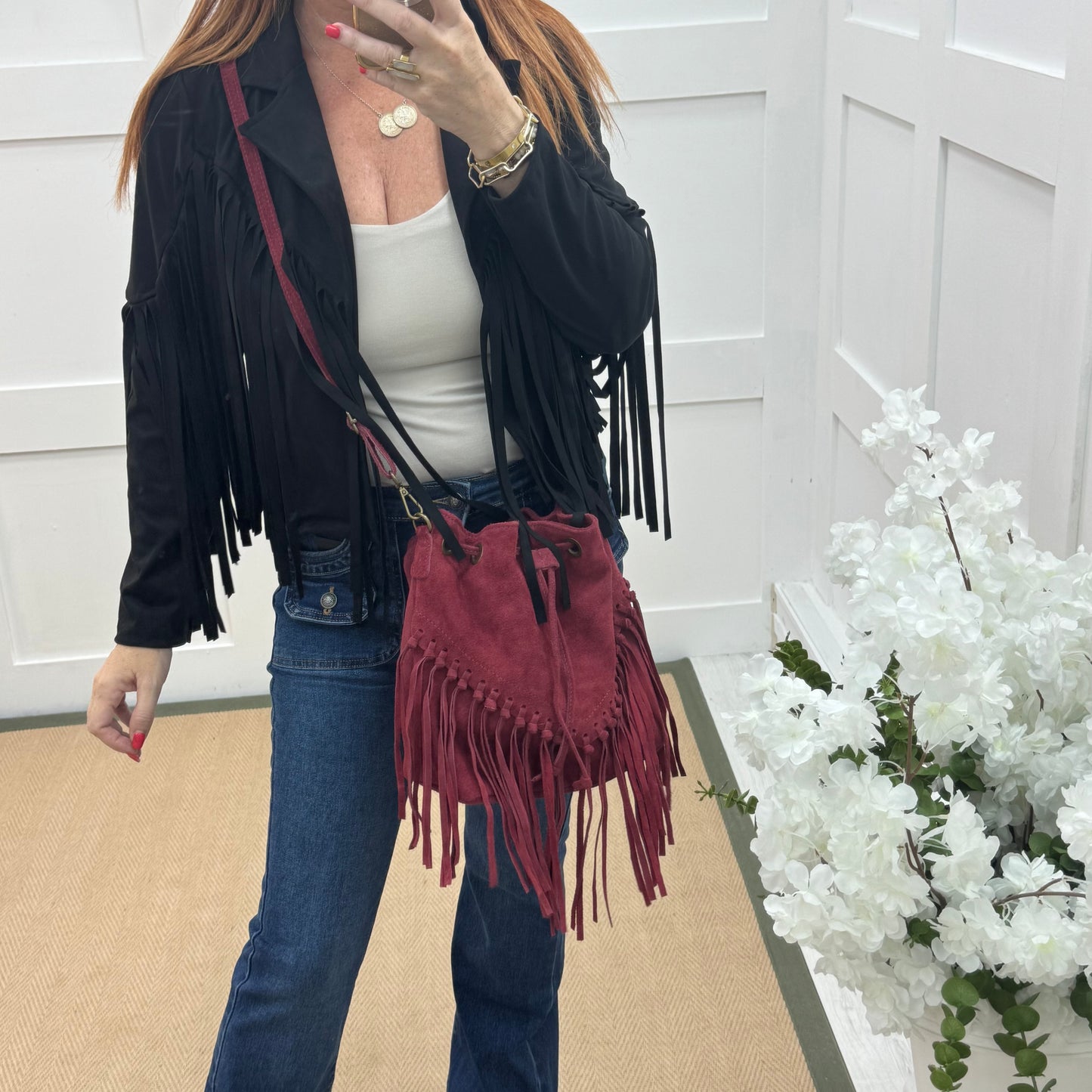 Athena: Burgundy real suede fringe cross body bag.