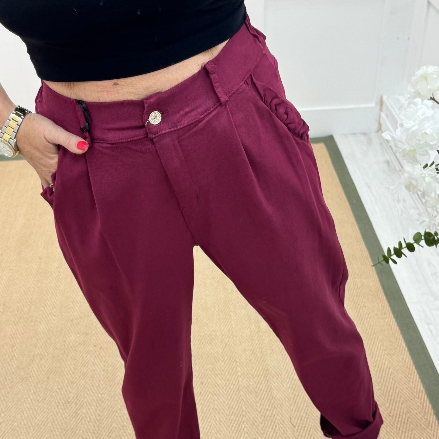 Mandi: Burgundy stretchy frill pocket magic trousers with rear pockets. One Size: 14-20