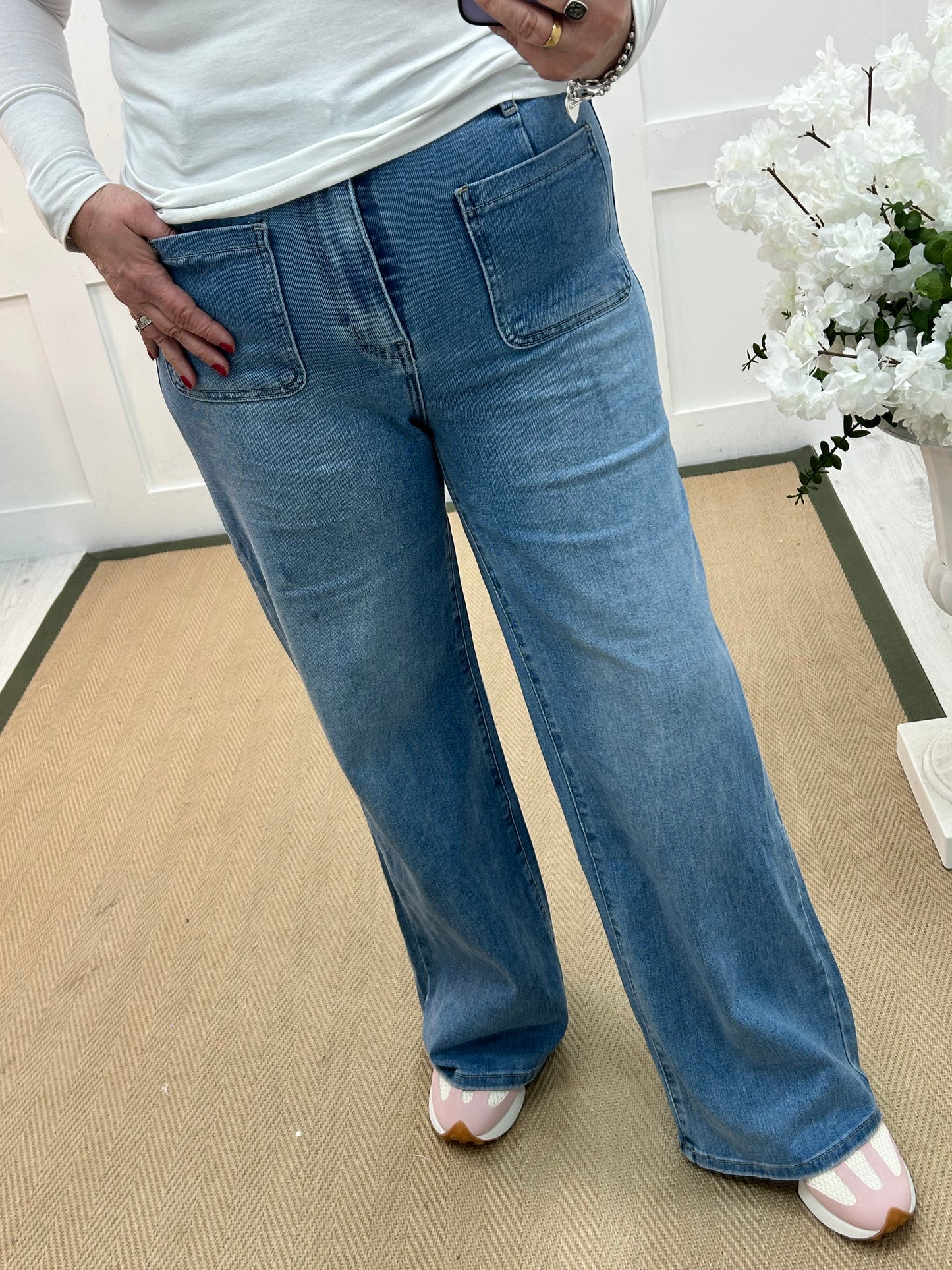 Polly: Washed denim front pocket wide leg jeans. Sizes: 8-16