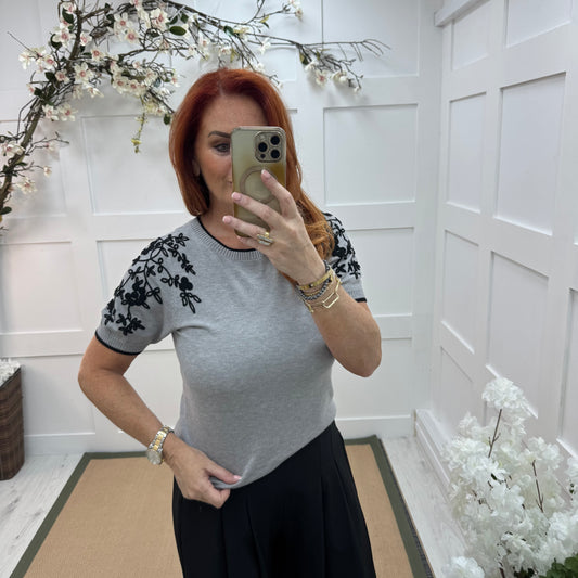 Henna: Grey stretchy knit embroidered top. 2 sizes