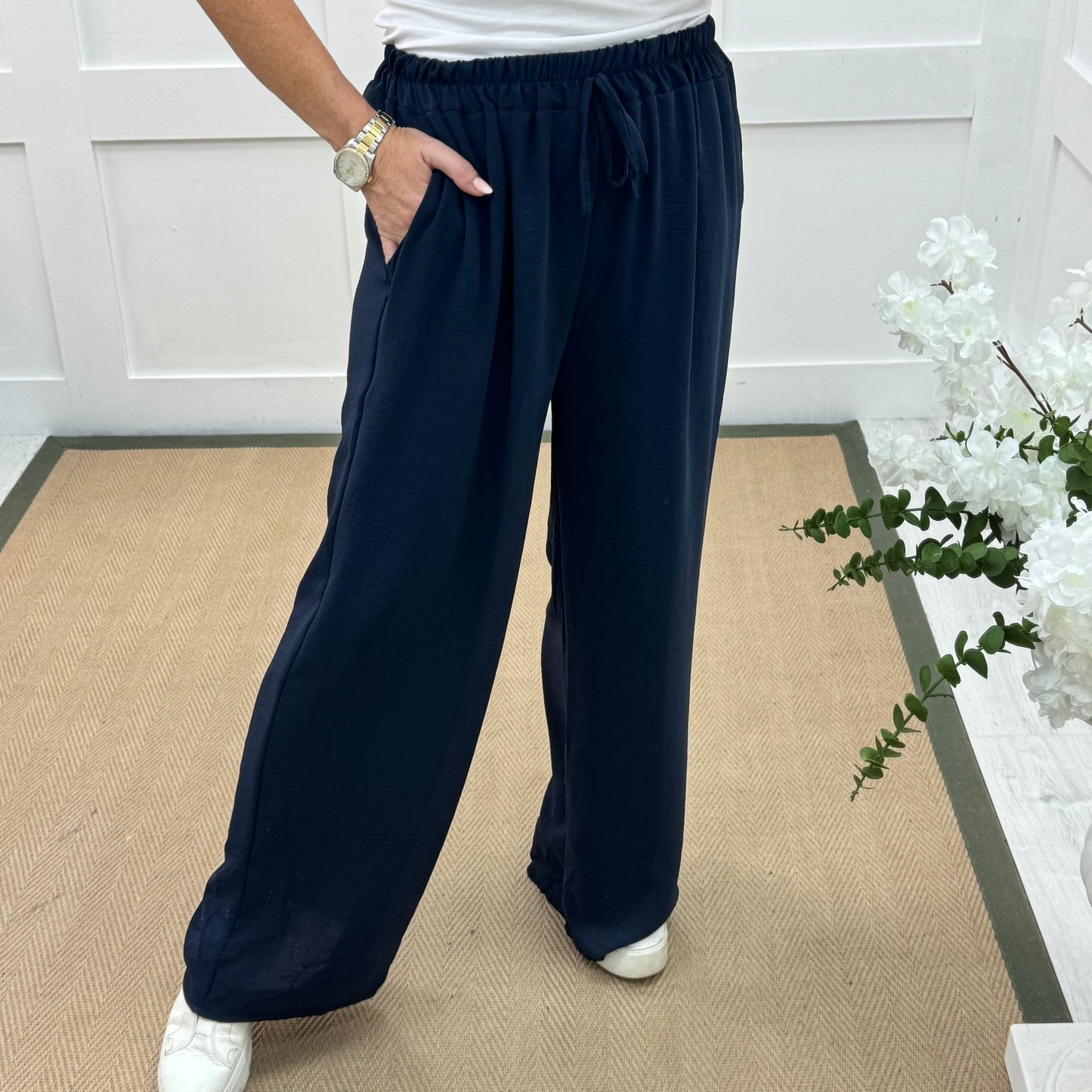 Esme: Navy pocket wide leg trousers. One size: 12-20