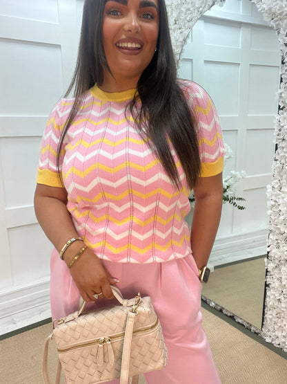 Kaya: Pink, white and yellow chevron short sleeved top. One Sz: 10-14
