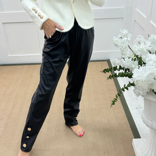 Tatum: Black faux leather button trousers. One size: 14-18