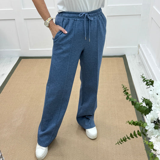 Trudy: Denim blue stretchy wide leg pocket trousers. 2 sizes