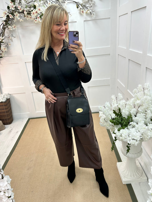 Allegra: Brown 3/4 faux leather belted trousers. One size: 14-18