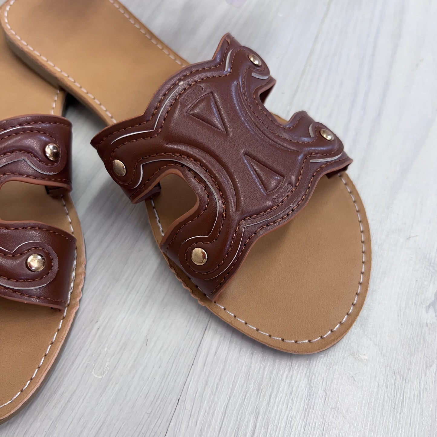 Lucia: Tan cut out style sliders. Sizes: 4-9