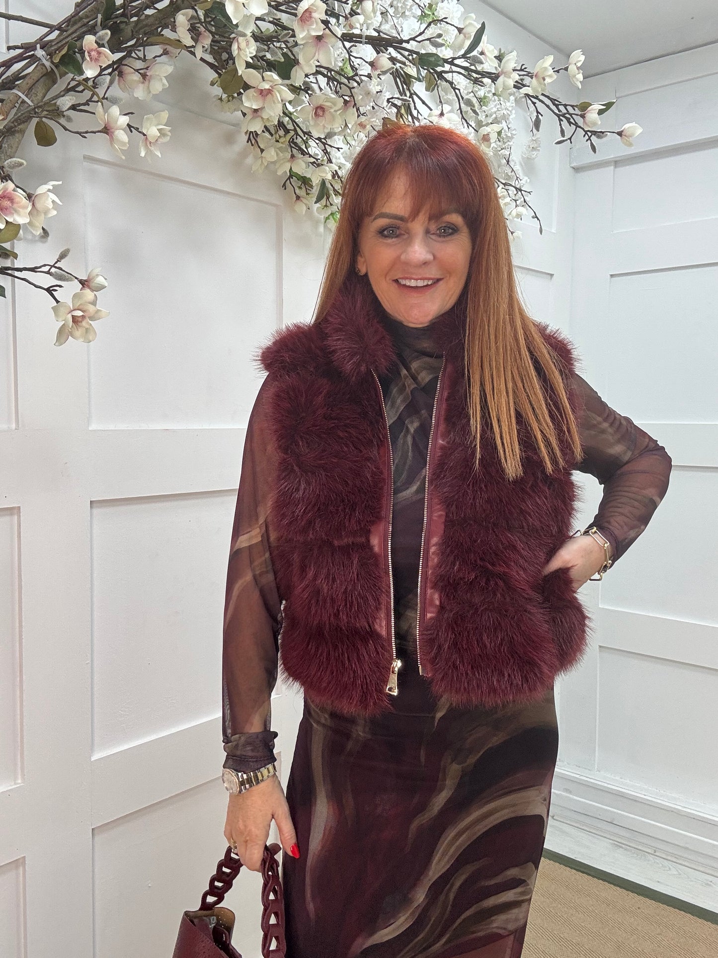 Kizzy: Burgundy zip up faux fur gilet. One size 8-16