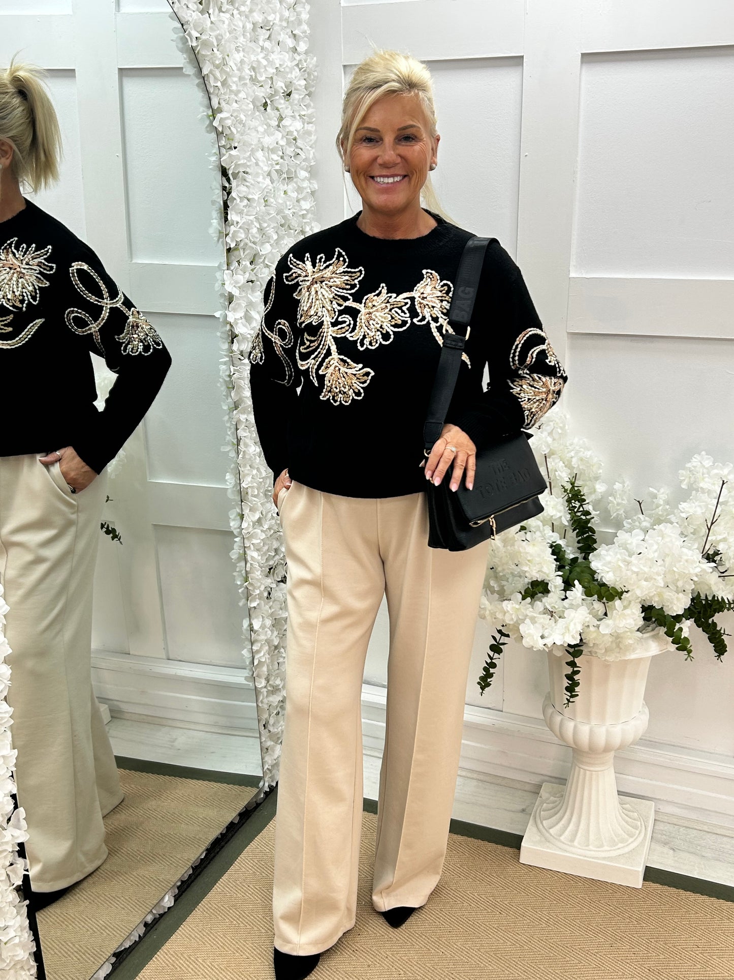 Honey: Black sequin floral knit top. One size: 10-16