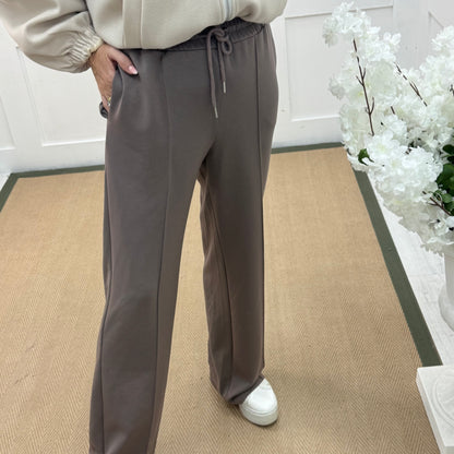 Trudy: Taupe stretchy wide leg pocket trousers. 2 sizes