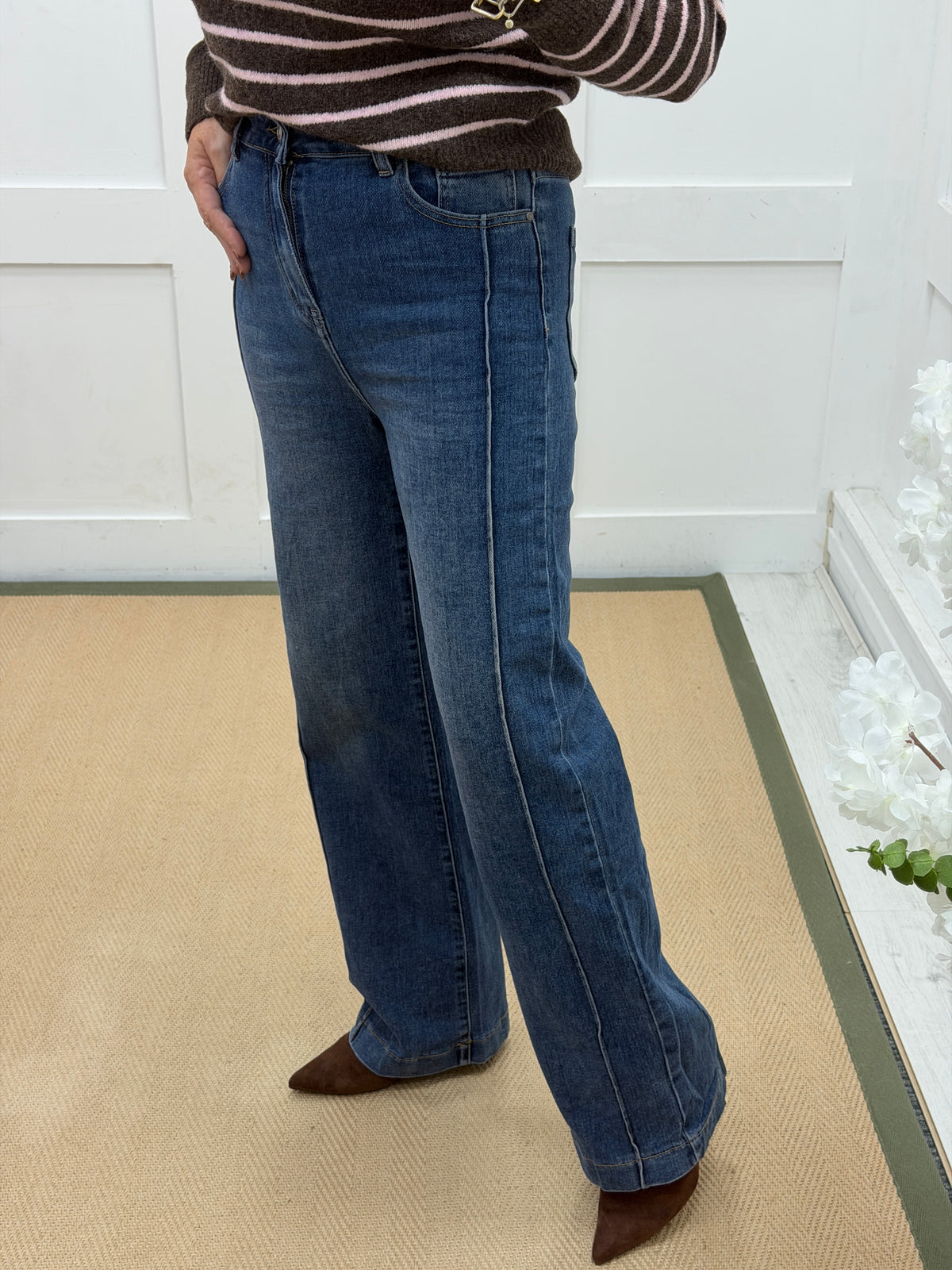 Raye: Mid blue wide leg jeans with raised seam. Sizes: 8-16