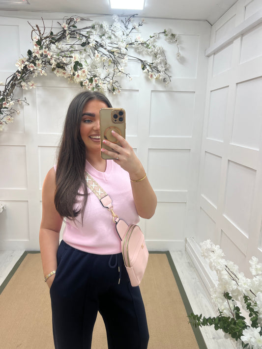 Tara: Pink V neck tank top. One size: 10-14