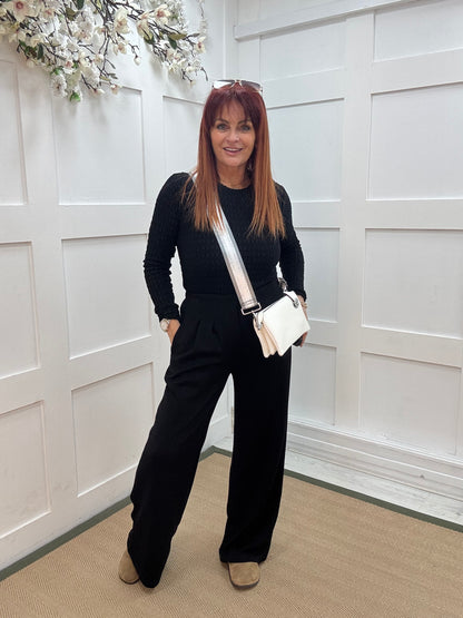 Tayla: Black high waisted pleated wide leg trousers. One size: 10-16