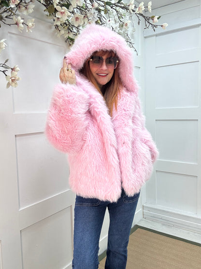 Foxy: Pink short faux fur hooded jacket. One size 12-16