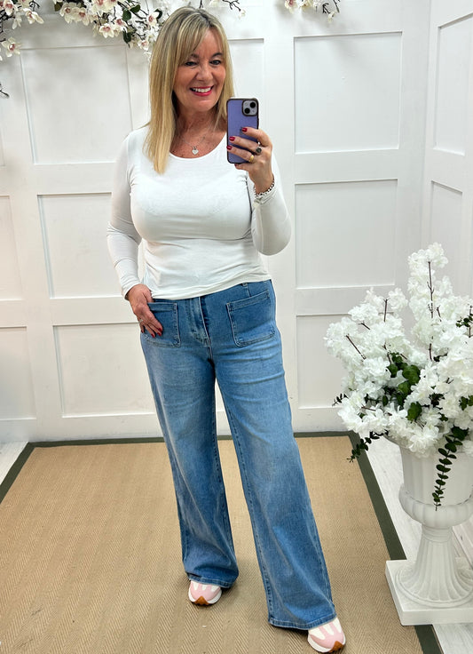 Polly: Washed denim front pocket wide leg jeans. Sizes: 10-20