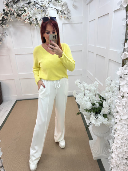 Trudy: White stretchy wide leg pocket trousers. 2 sizes