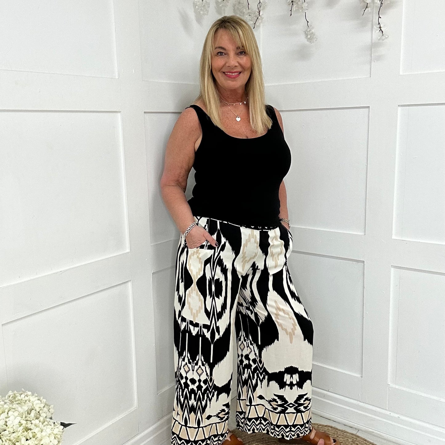 Brooke: Black aztec print wide leg trousers. One size: 12-18