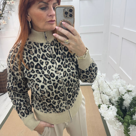 Ursula: Cream leopard print zipped neck top. One size: 12-18