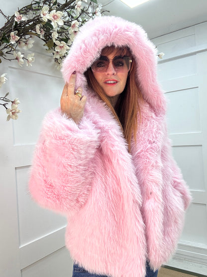 Foxy: Pink short faux fur hooded jacket. One size 12-16