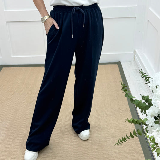 Trudy: Navy stretchy wide leg pocket trousers. 2 sizes