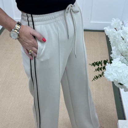 Roxi: Cream stretchy pocket sports trousers. 3 sizes