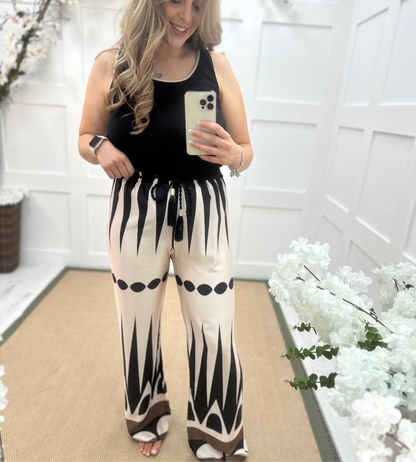 Diana: Cream & black printed wide leg trousers. One size: 10-16