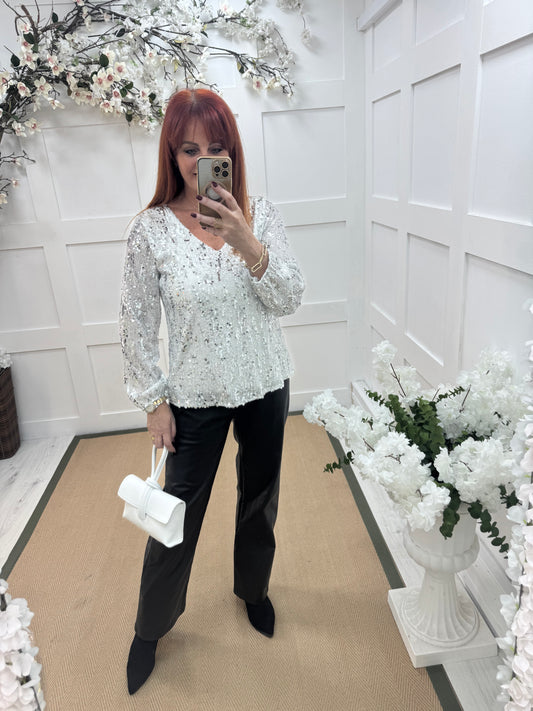 Sutton: White v-neck sequin top. One size: 12-16