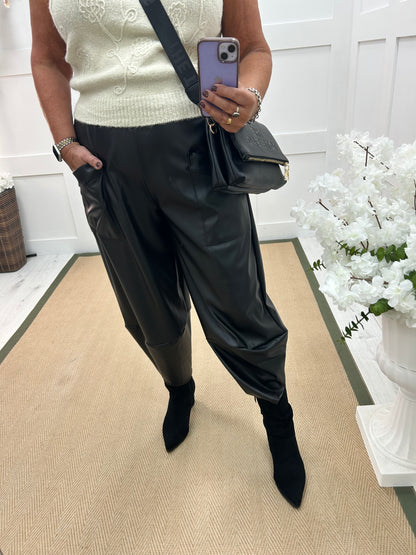 Drew: Black faux leather cocoon trousers. One size: 12-18