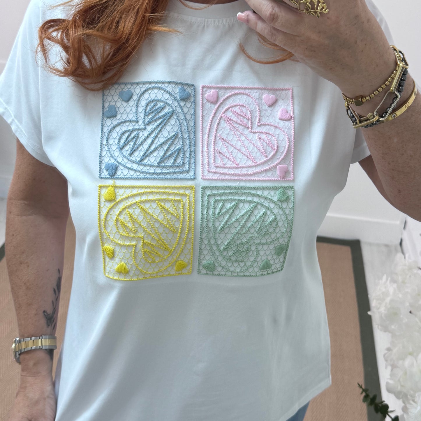 Sophie: White embroidered blue heart T shirt. One size 14-18