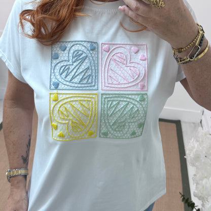 Sophie: White embroidered blue heart T shirt. One size 14-18