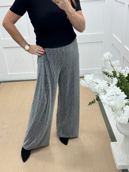Sandy: Silver lurex wide leg trousers. One size: 12-18