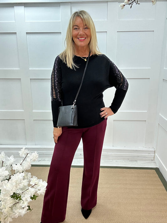 Arianne: Black sparkle cutout shoulder top. One size: 12-16