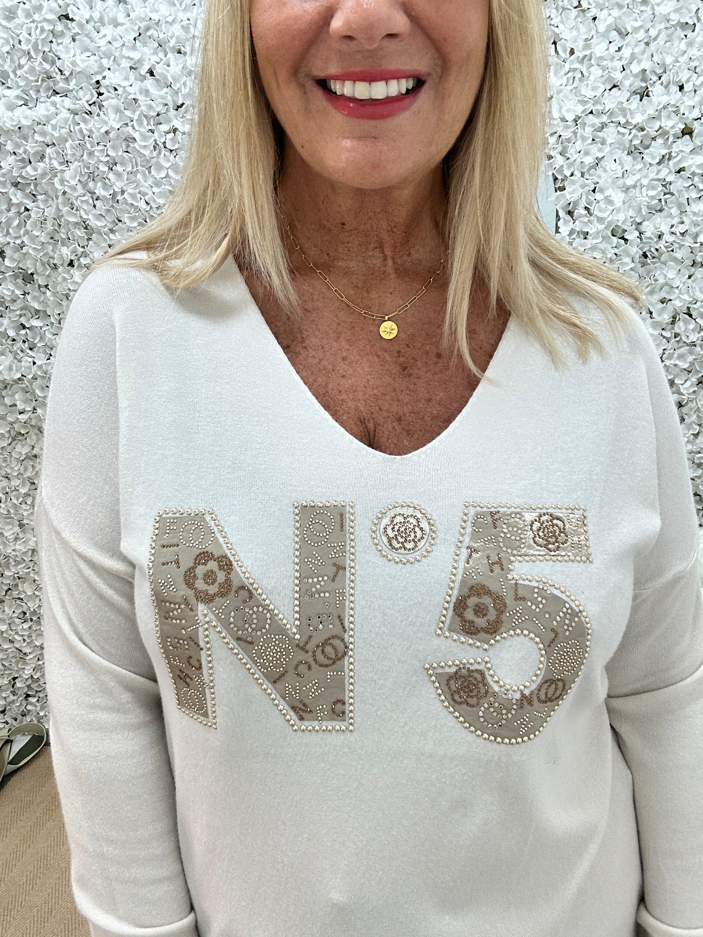 Cass: Cream V neck diamanté No5 knit top. One size: 14-20