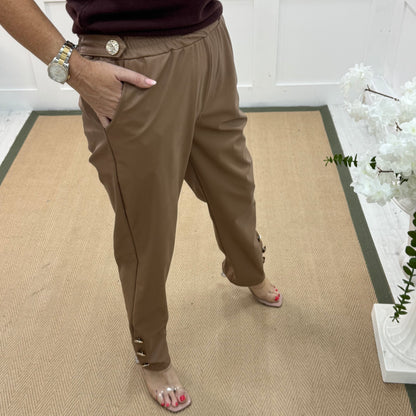 Tatum: Coffee faux leather button trousers. One size: 14-18
