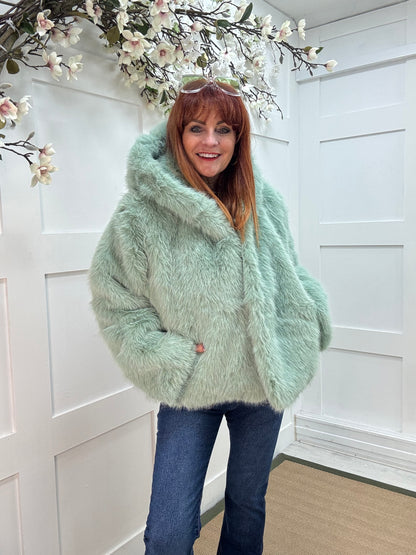 Foxy: Mint green short faux fur hooded jacket. One size 12-16