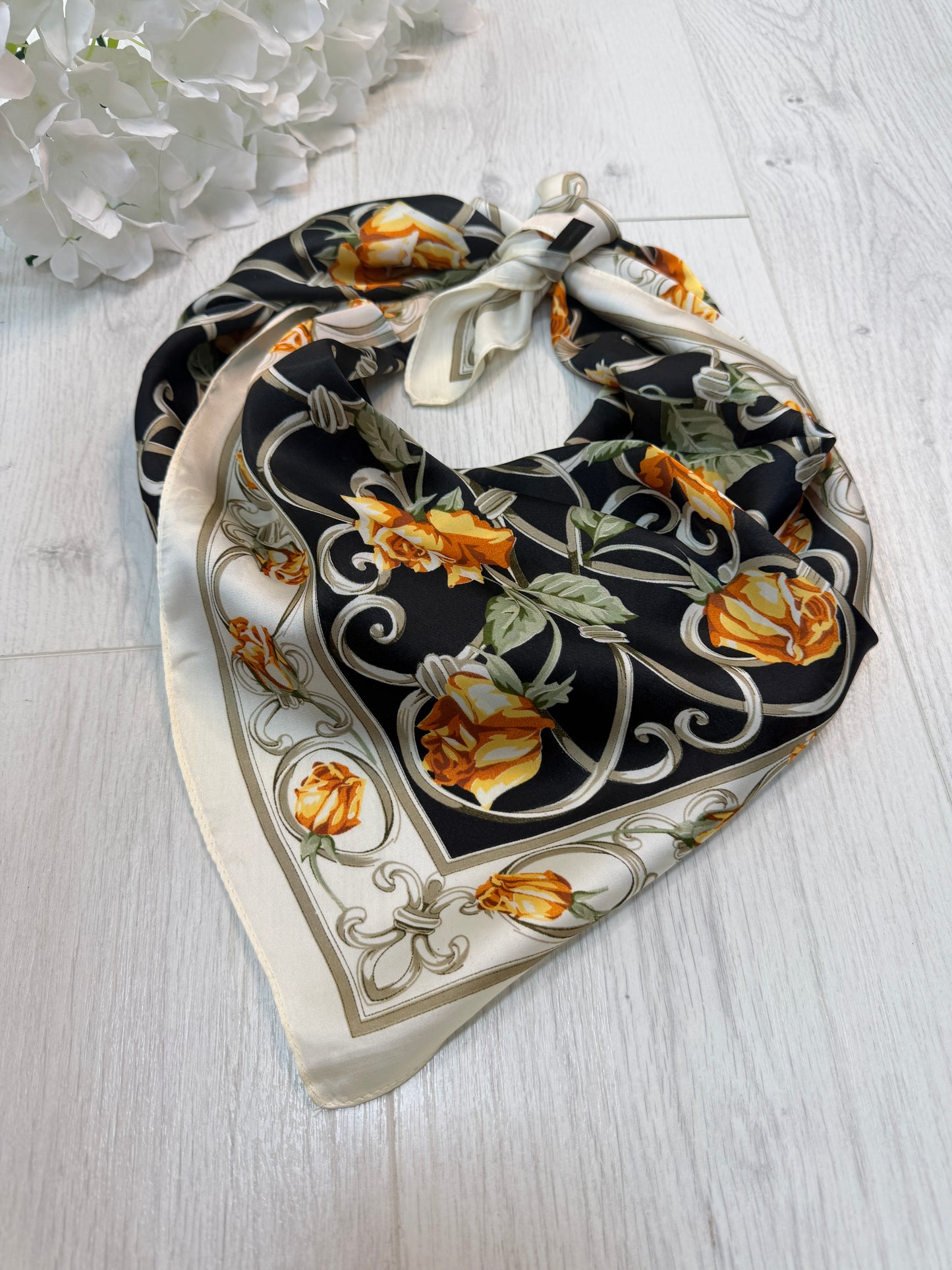 Rona: Black & orange rose  print silky neck scarf.