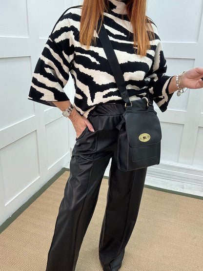 Tabatha: Black faux leather trousers. One size: 12-16