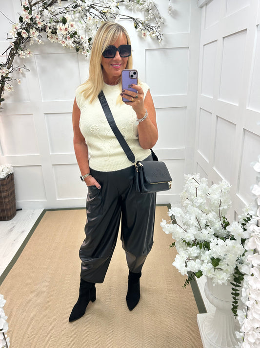 Drew: Black faux leather cocoon trousers. One size: 12-18