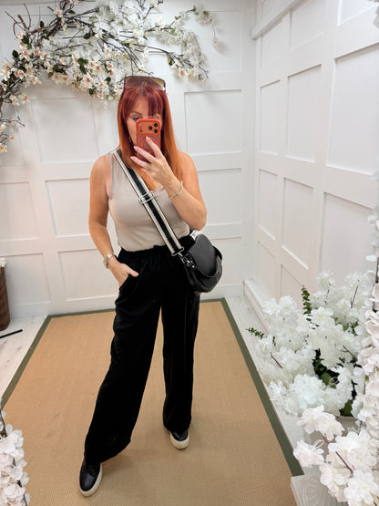 Leanne: Black wide leg trousers. One size: 10-14